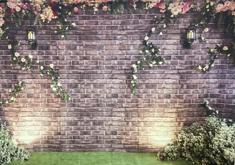 Brick wall with flowers backdrop
